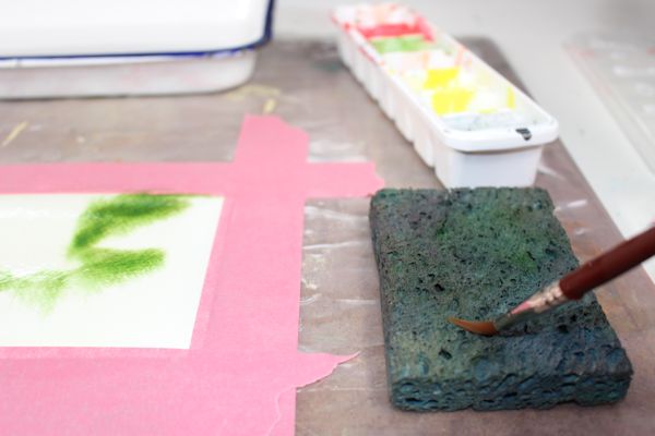  You can use a wet sponge on the side of your painting to clean and dry your brush in between colors.