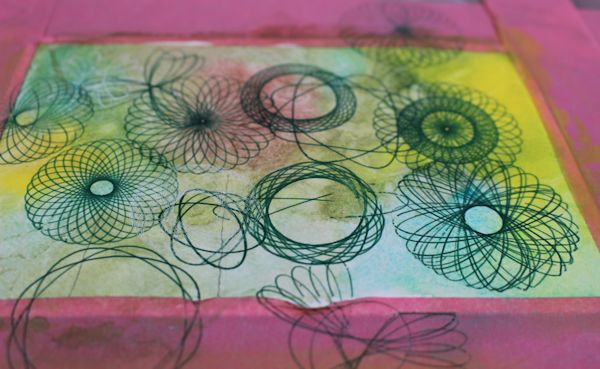 adding spirograph patterns to the watercolor background