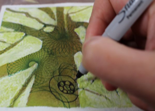  drawing patterns with sharpies on the tree