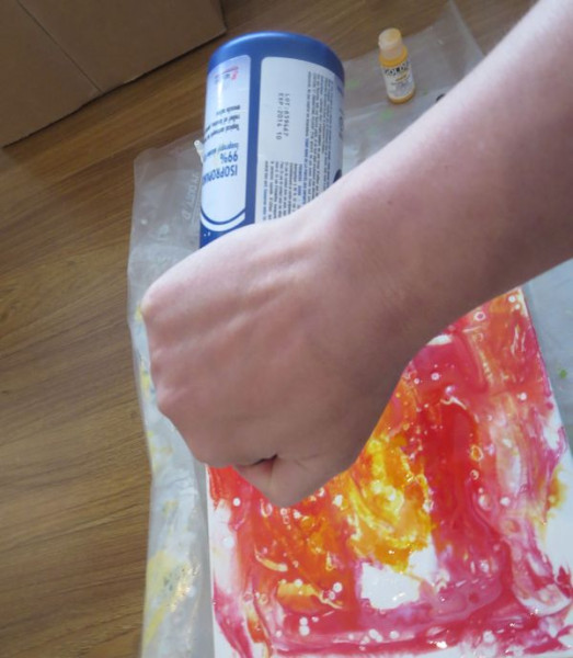 add visual texture by dripping some alcohol on the paint and gel medium