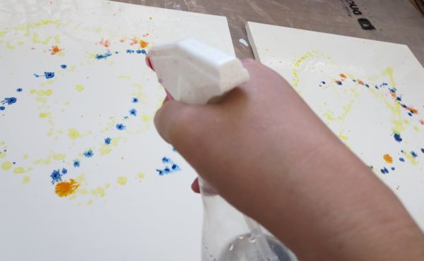 Spraying water on fluid acrylic inks and gel medium