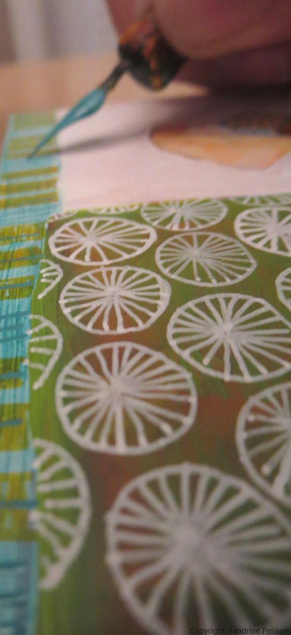 A series of three mixed media flowers on yupo paper