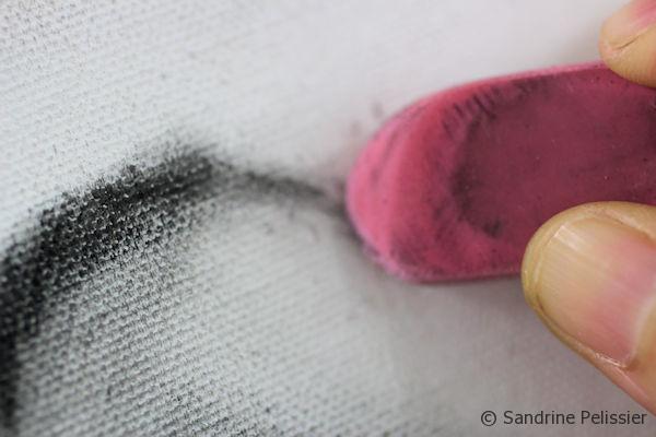 erasing dry brush oil with an eraser on canvas