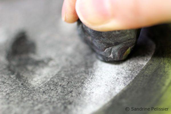 taking off charcoal with a kneadable eraser