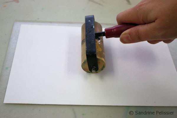 You can use a brayer to apply pressure on your paper, or a barren or a wooden spoon.